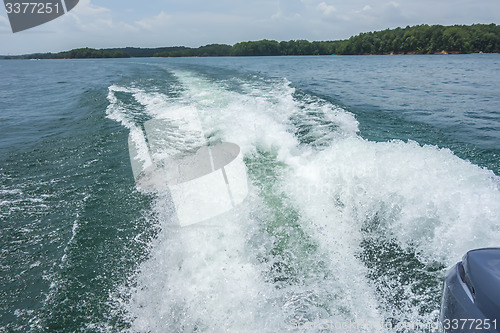 Image of wake waves from boat on lake