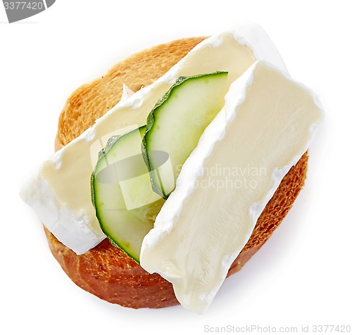 Image of toasted bread with brie and cucumber