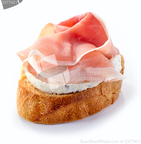Image of toasted bread with cream cheese and prosciutto