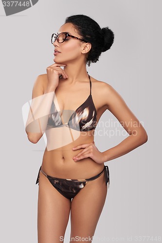 Image of Smiling woman in swimsuit