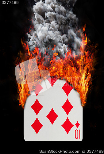 Image of Playing card with fire and smoke