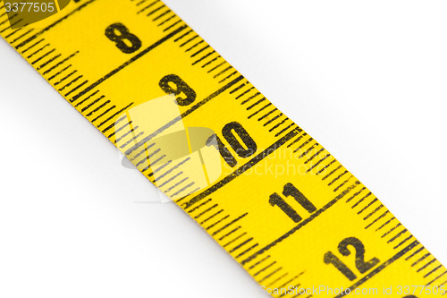 Image of Yellow measuring tape isolated - selective focus