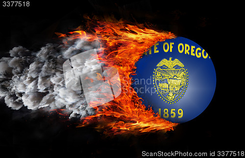 Image of Flag with a trail of fire and smoke - Oregon