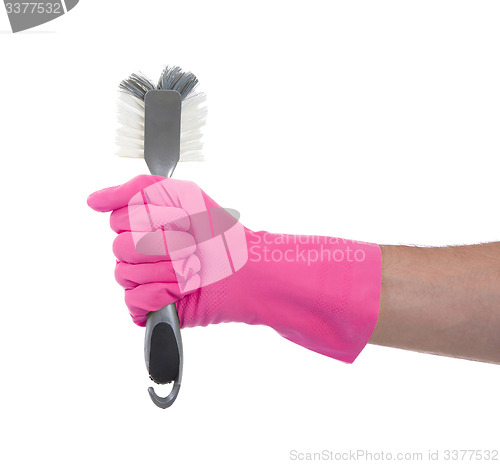 Image of Protection glove holding a dish-brush