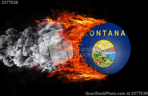 Image of Flag with a trail of fire and smoke - Montana