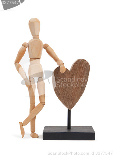 Image of Wooden mannequin with a big heart