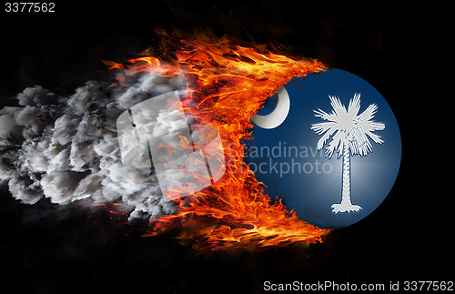 Image of Flag with a trail of fire and smoke - South Carolina