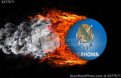 Image of Flag with a trail of fire and smoke - Oklahoma