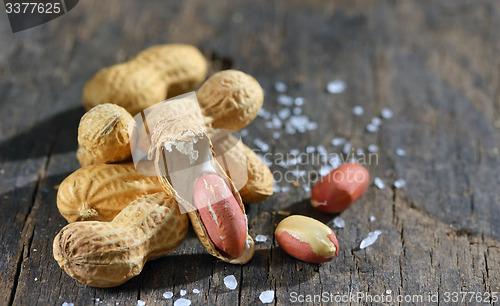 Image of peanut isolated on wooden background