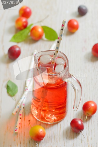 Image of Plum compote and fresh plums with ice cubes