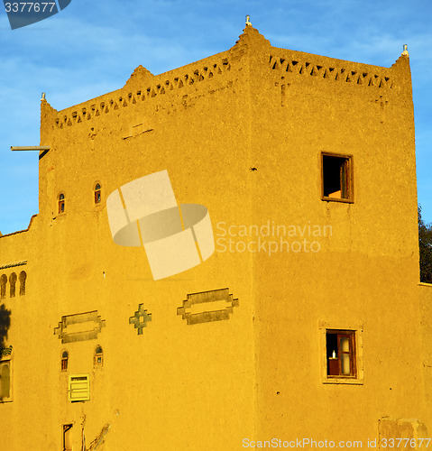 Image of old brown construction in africa   morocco and sky  near the tow