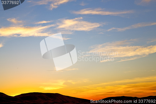 Image of the sunrise in mountain  clouds and  background