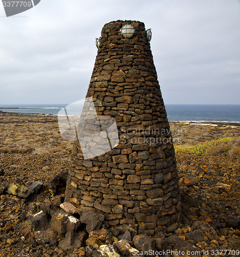 Image of tower spain  hill      black rocks   the   lanzarote 