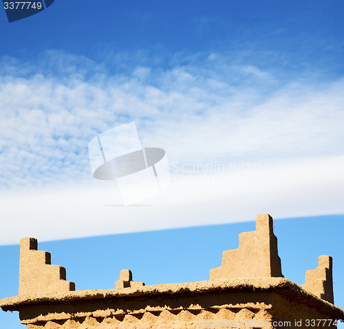 Image of brown old  construction in africa morocco and red leather near t