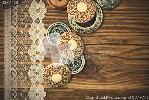 Image of vintage button and lace tape