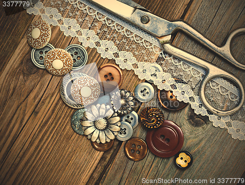 Image of vintage buttons, lace, and a dressmaker scissors