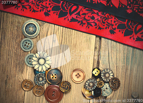 Image of vintage tape, lace, ribbons and old buttons