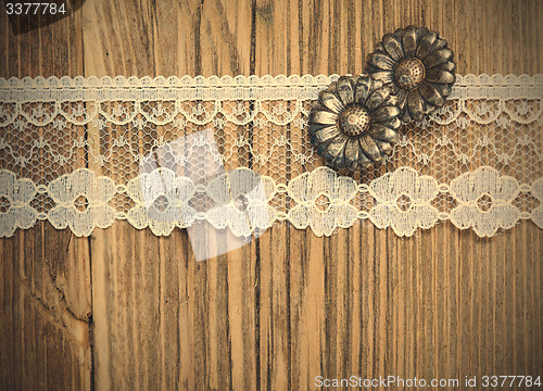 Image of vintage button and lace tape