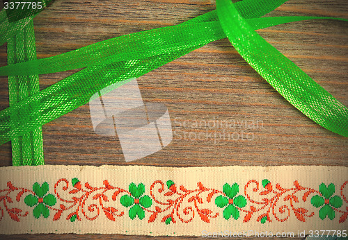 Image of vintage embroidered band and green tape