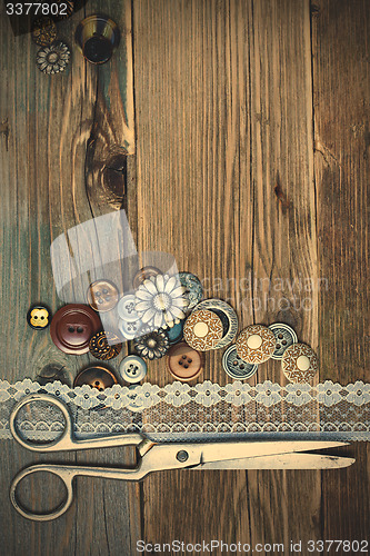 Image of vintage buttons, lace, and a dressmaker scissors