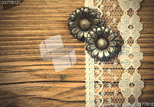 Image of vintage metal buttons flowers and lace tape