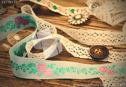 Image of ribbon, lace, ribbons and buttons
