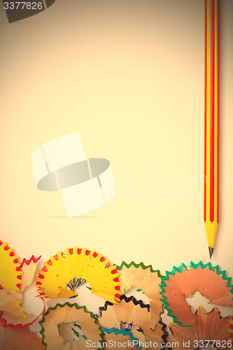 Image of striped pencil and colored shavinsg