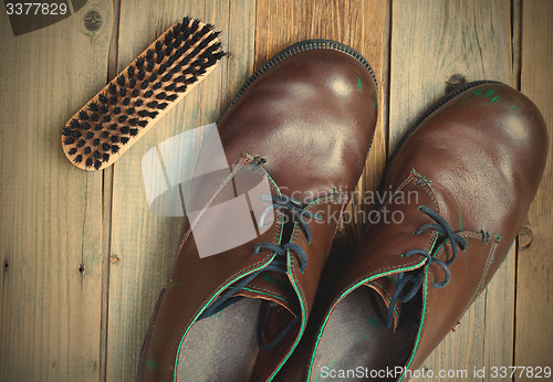 Image of vintage boots brush and shoe polish