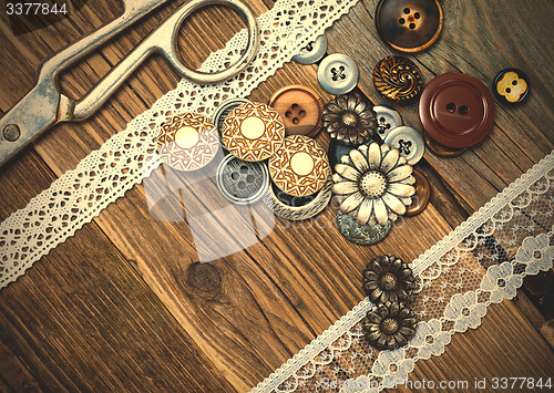 Image of vintage buttons, lace, and a dressmaker scissors