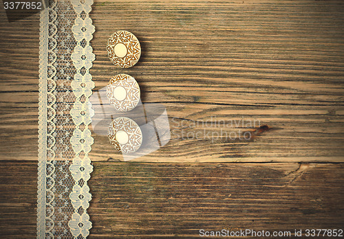 Image of three vintage button and lace tape