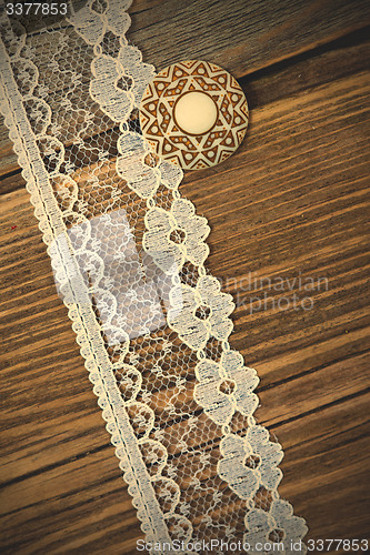 Image of vintage button and lace tape