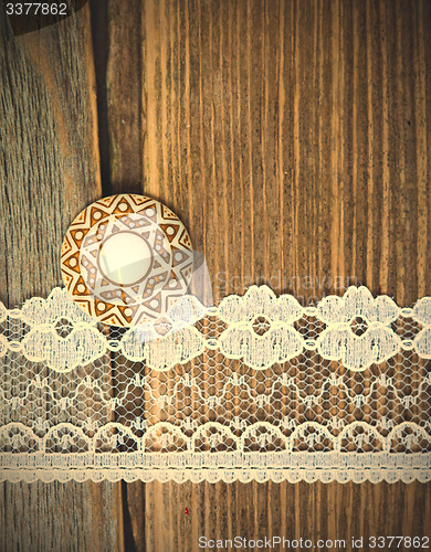 Image of vintage button and lace tape