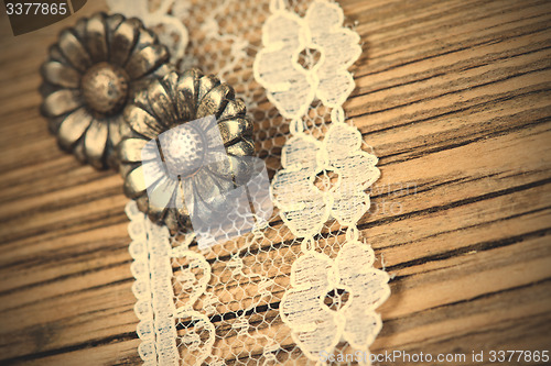 Image of vintage button and lace tape