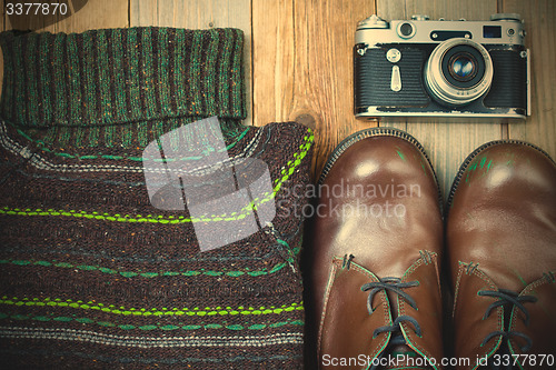 Image of Vintage sweater, shoes, antique rangefinder camera
