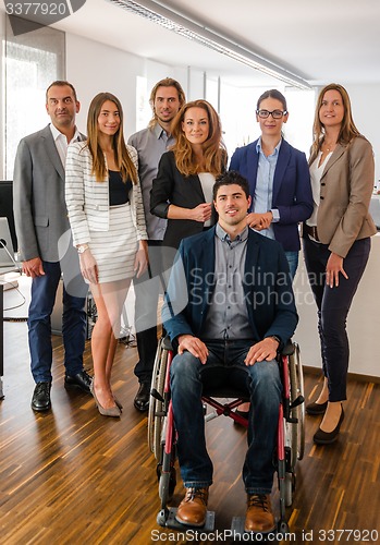 Image of Portrait Of Business Team With Wheelchair