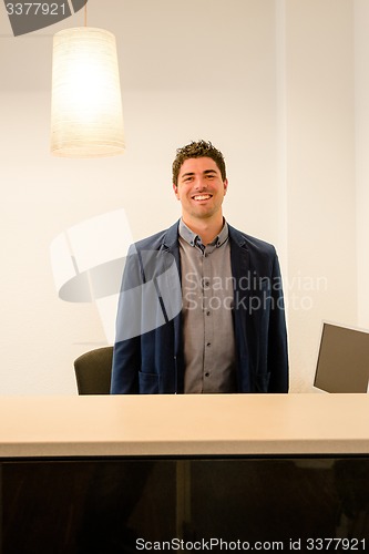 Image of Young receptionist smiling