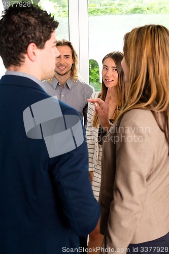 Image of Businesspeople discussing in office