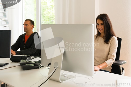 Image of Office people being absorbed in their work