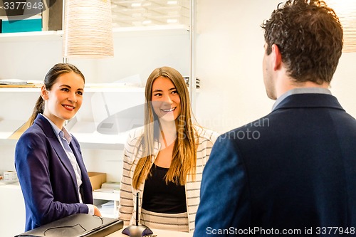 Image of Conversation at the office reception