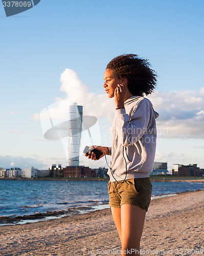 Image of smiling female on beach