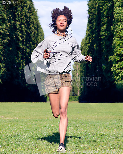 Image of female running in park