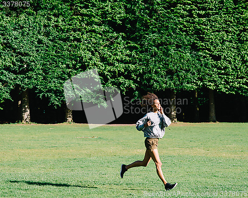 Image of female running in park