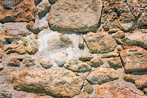 Image of Fragment of an ancient wall from stones. (Background image)