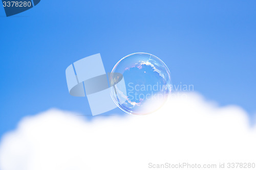 Image of Clear bubble in blue cloudy sky