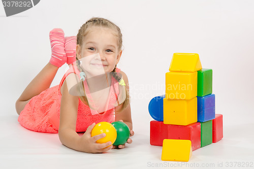 Image of Happy child in the house out of blocks