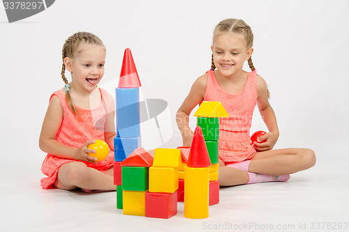 Image of Two girls built a castle out of blocks