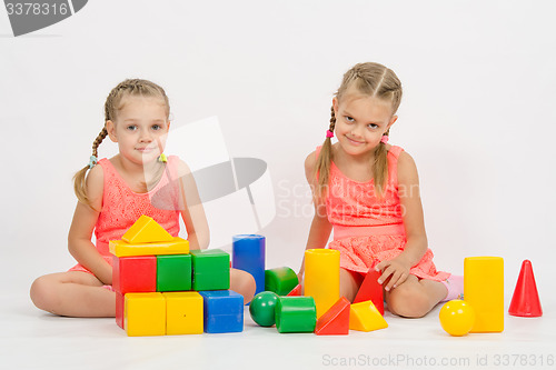 Image of Sisters playing with blocks