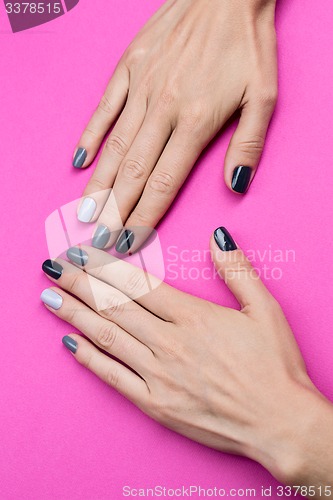 Image of Delicate female hands with a stylish neutral manicure