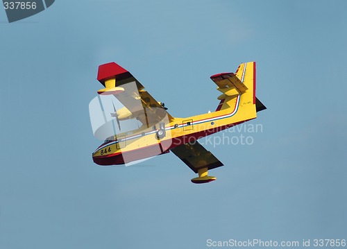 Image of Firefighting airplane descending for water