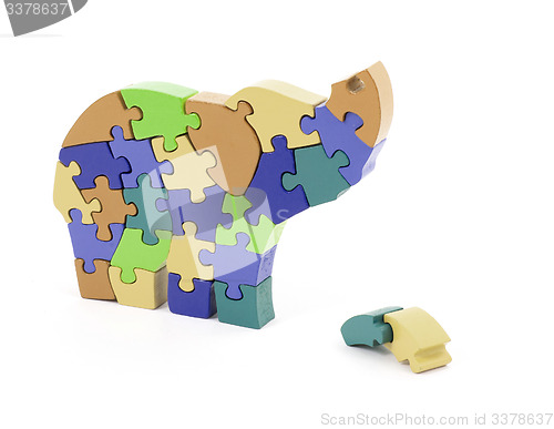 Image of Colorful puzzle pieces in elephant shape